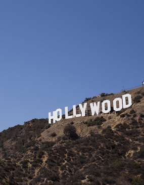 Hollywood Sign perched on a sunny hillside Hollywood Sign perched on a sunny hillside